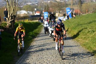 HARELBEKE BELGIUM MARCH 25 LR Christophe Laporte of France and Wout Van Aert of Belgium and Team Jumbo Visma compete in the breakaway through Kwaremont cobblestones sector during the 65th E3 Saxo Bank Classic 2022 a 2039km one day race from Harelbeke to Harelbeke E3SaxobankClassic WorldTour on March 25 2022 in Harelbeke Belgium Photo by Tim de WaeleGetty Images