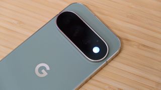 The Google Pixel 11 Pro resting on a wooden table