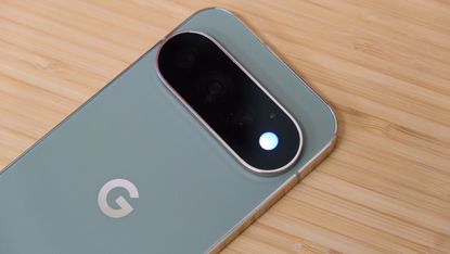 The Google Pixel 11 Pro resting on a wooden table