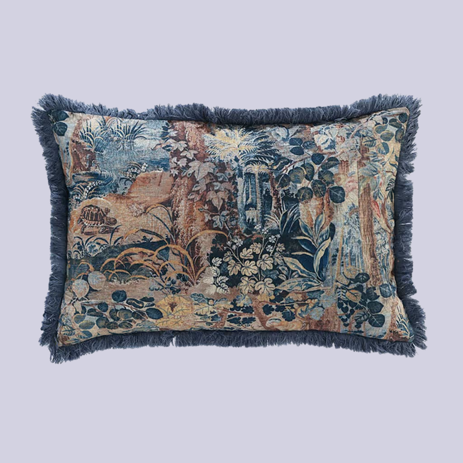 A patterned blue pillow with a fringe hem