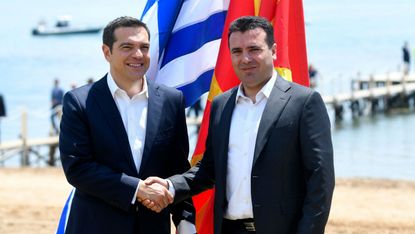 Macedonian Prime Minister Zoran Zaev welcomes his Greek counterpart Alexis Tsipras ahead of Sunday's signing ceremony
