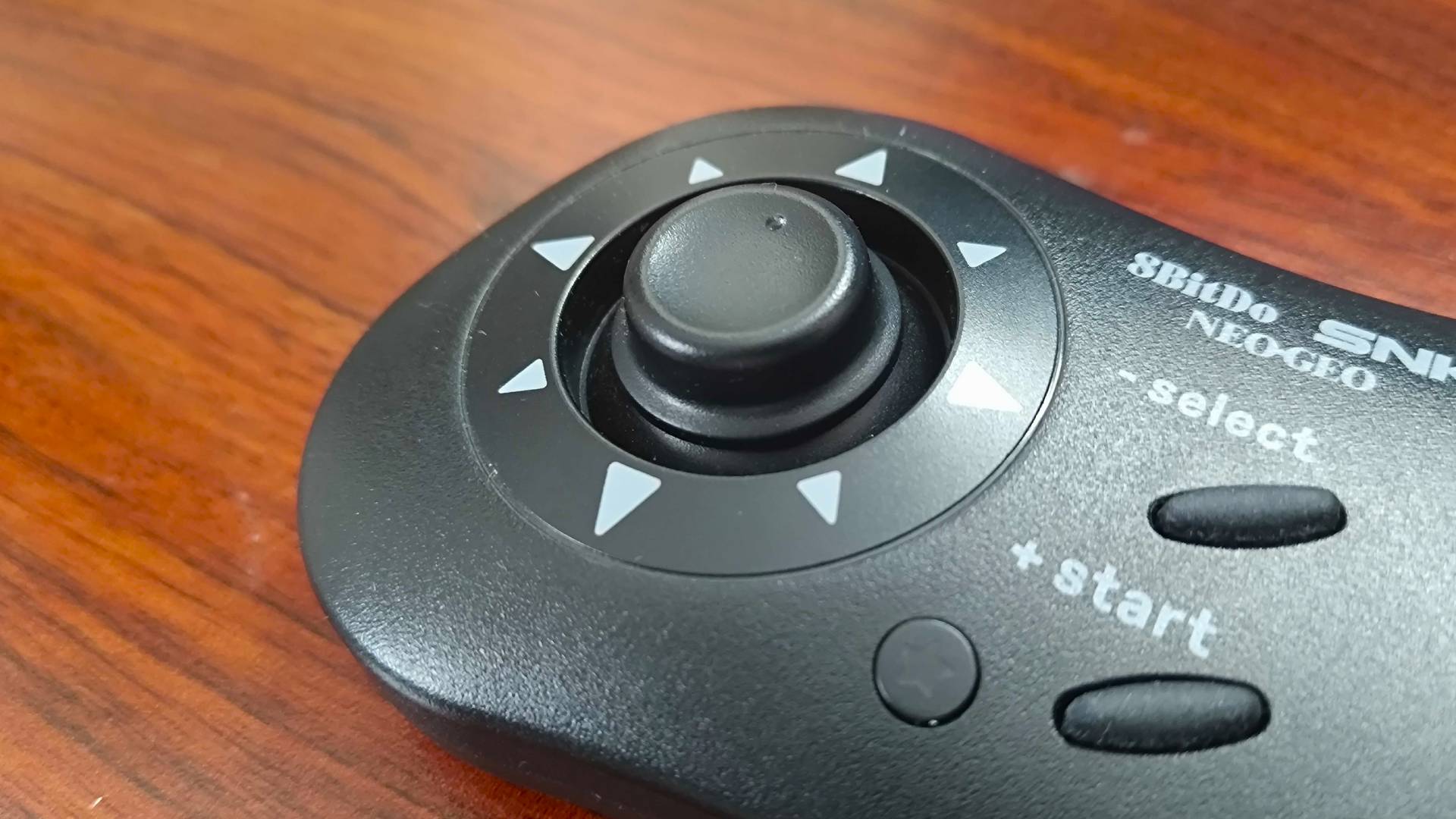 Close up of 8bitdo Neo Geo controller thumbstick.