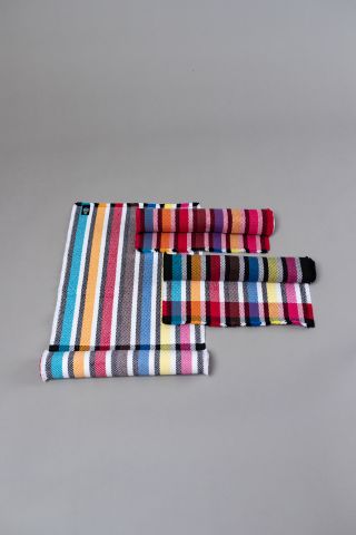 Textile table runners with colourful striped motif