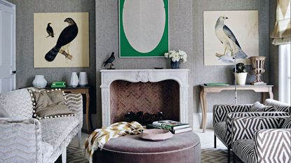 Living room, Herringbone wallpaper, alcove console table, hawk bird of prey paintings, armchairs, sofa