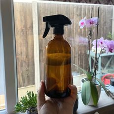 Brown glass bottle filled with pure magic cleaner