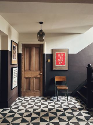 dark hallway with patterned tile flooring