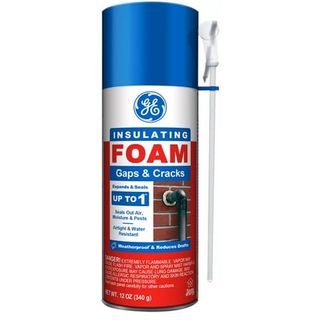 A can of insulating foam with a blue lid and a red base. 