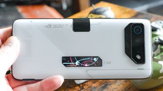 Asus ROG Phone 7 Ultimate back showing OLED display with flashing lights