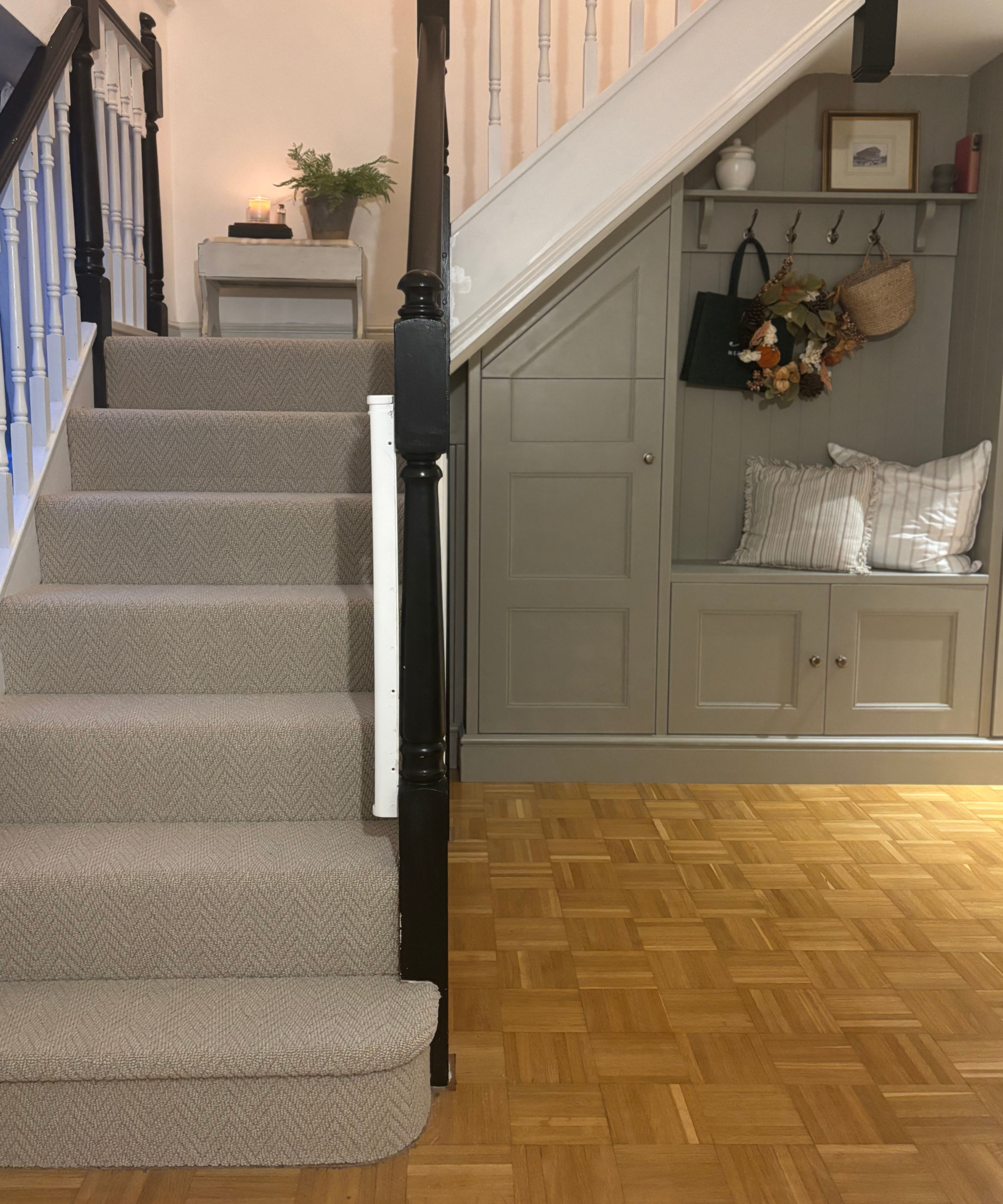 built in nook understairs with storage, hooks and seat