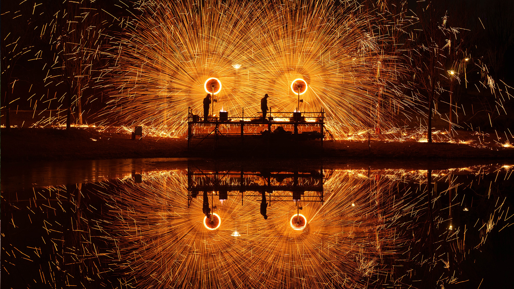 Molten iron fireworks light up the night sky in Beijing, China