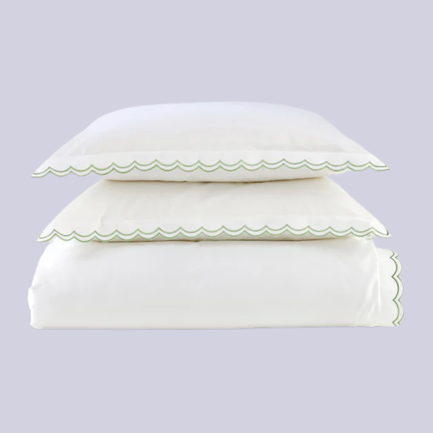 A white duvet set with green scalloped details