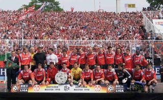 Kaiserslautern's players and staff celebrate their Bundesliga title in front of the fans in May 1998.