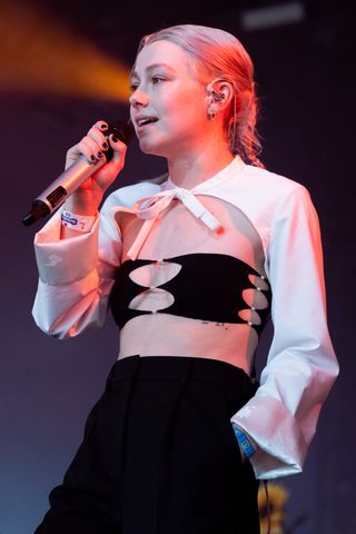Best Coachella Fashion Looks | Singer Phoebe Bridgers performs as a special guest in The Gobi Tent during Week 2, Day 2 of the 2022 Coachella Valley Music and Arts Festival on April 23, 2022 in Indio, California.