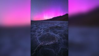 Purple northern lights over Death Valley, USA.