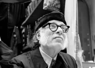 View of American science fiction & mystery writer Isaac Asimov (1920 - 1992) as he attends at the 5th Avenue Book Fair, New York.