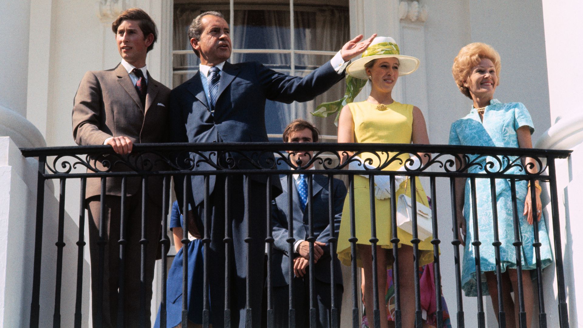 President and Mrs. Nixon welcome Prince Charles and Princess Anne on the balcony of the South Portico of the White House, 1970