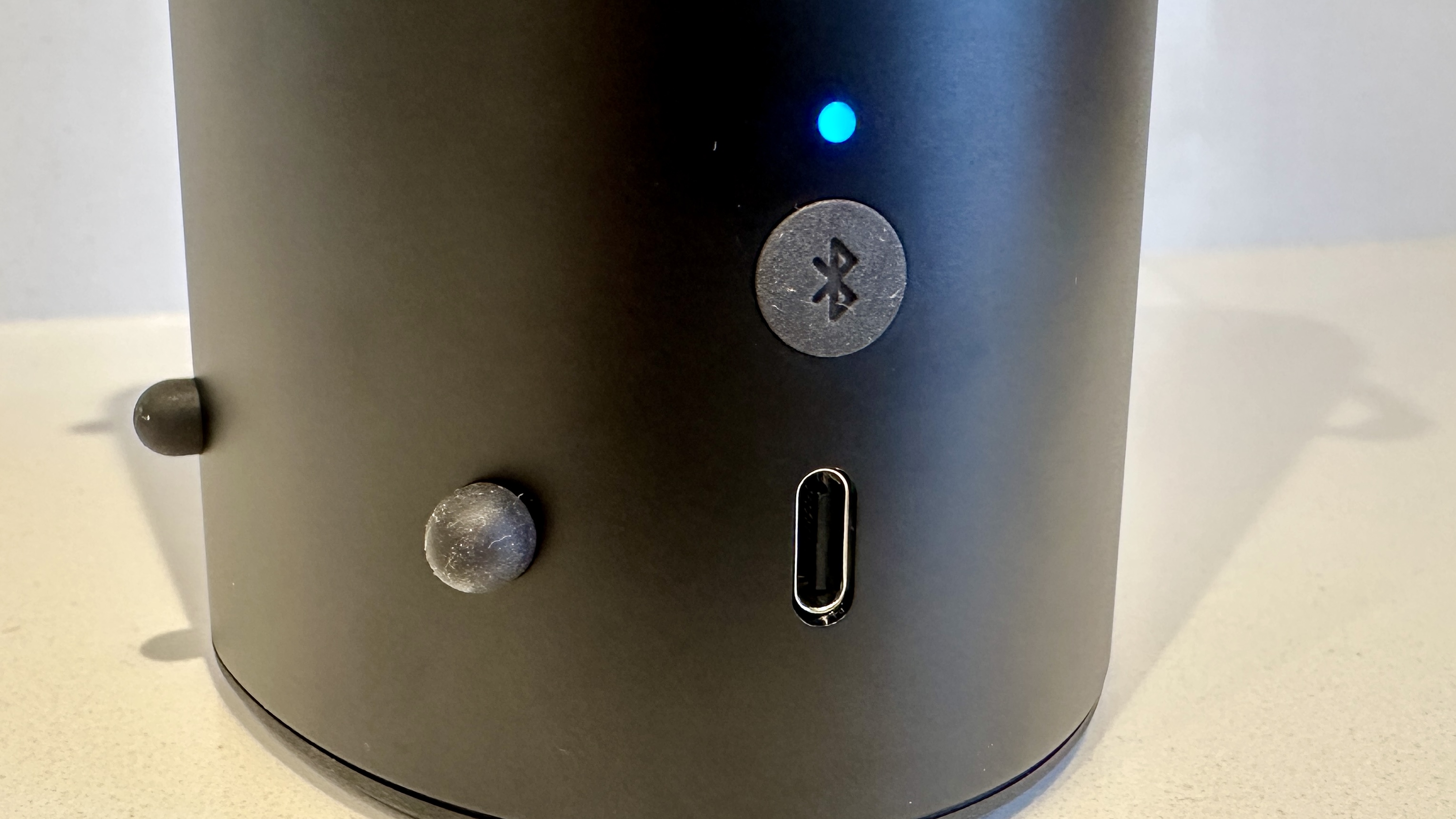 KEF Muo 2025 in black, on a white table