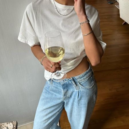 Woman in white tee and jeans