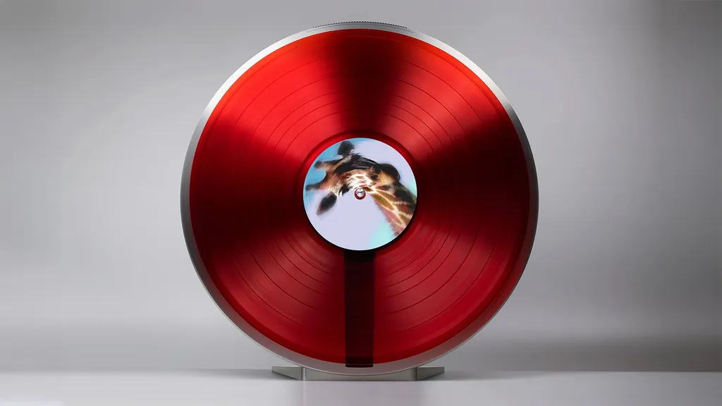 The Miniot Wheel 3 playing a red vinyl record against a grey background
