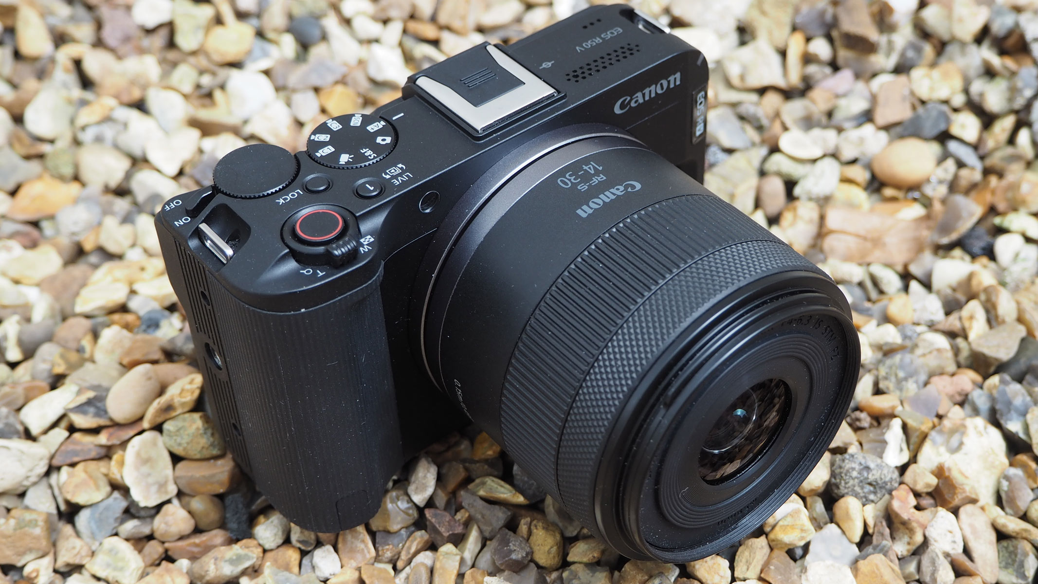 The Canon ESO R50 V on gravel, shot taken from the side.