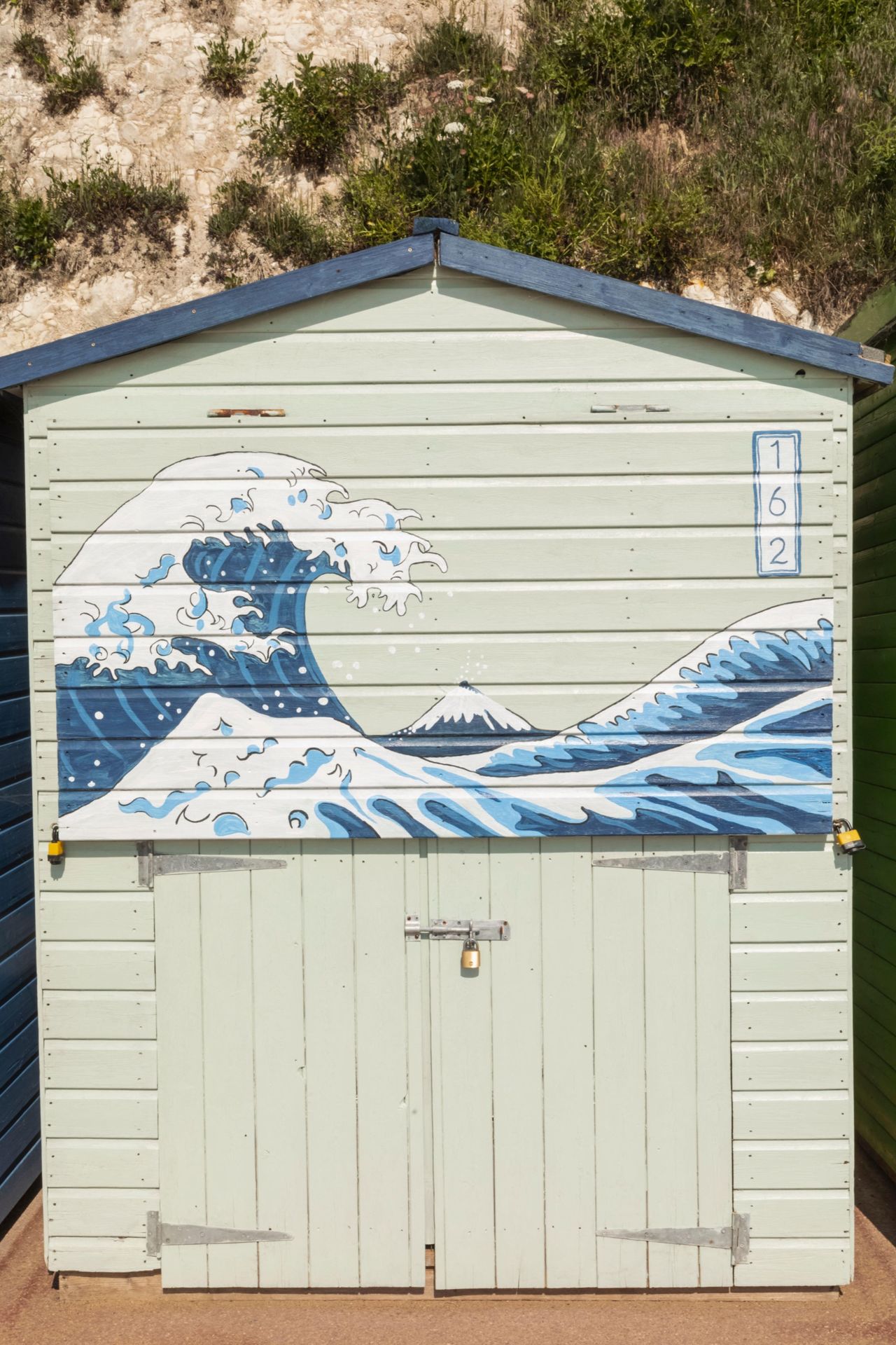 The Great Wave painting reproduced on the side of a house