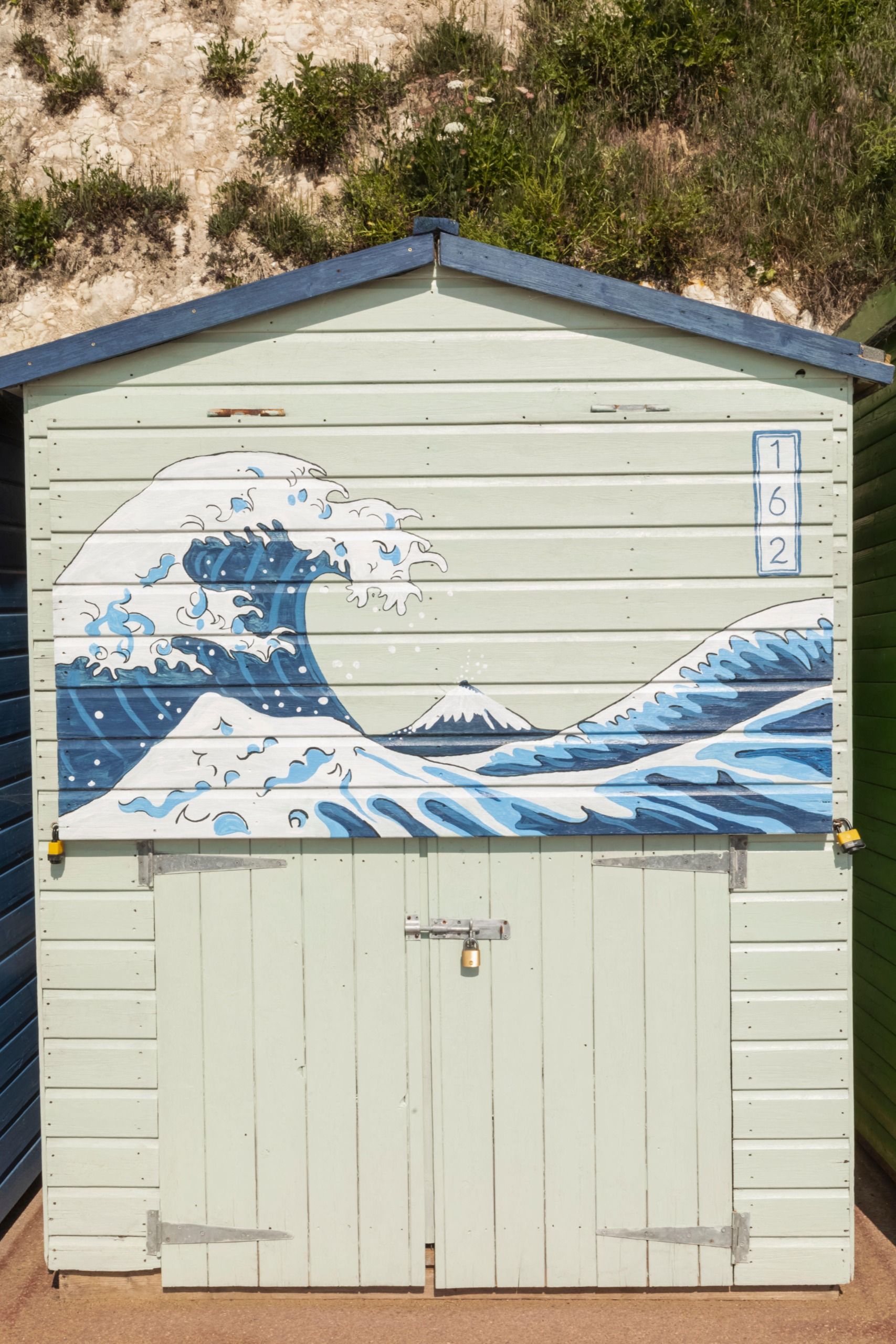 The Great Wave painting reproduced on the side of a house