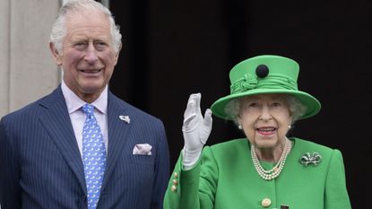 Queen Elizabeth II and King Charles, Prince of Wales stand on the balcony at Buckingham Palace at the end of the Platinum Pageant on The Mall on June 5, 2022