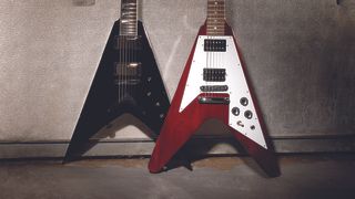 Dean Guitars V Series guitar next to a Gibson Flying V