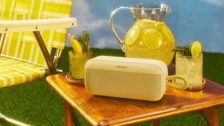 Bose SoundLink Plus in yellow on a table