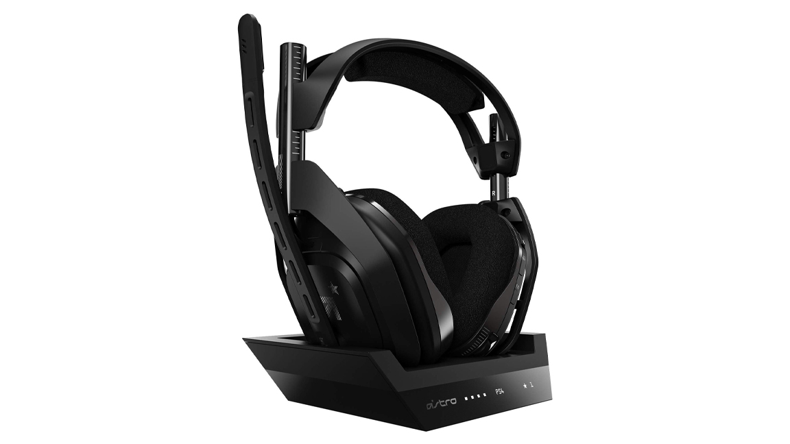 Astro A50 multi-platform gaming headset on its charging stand against a white background