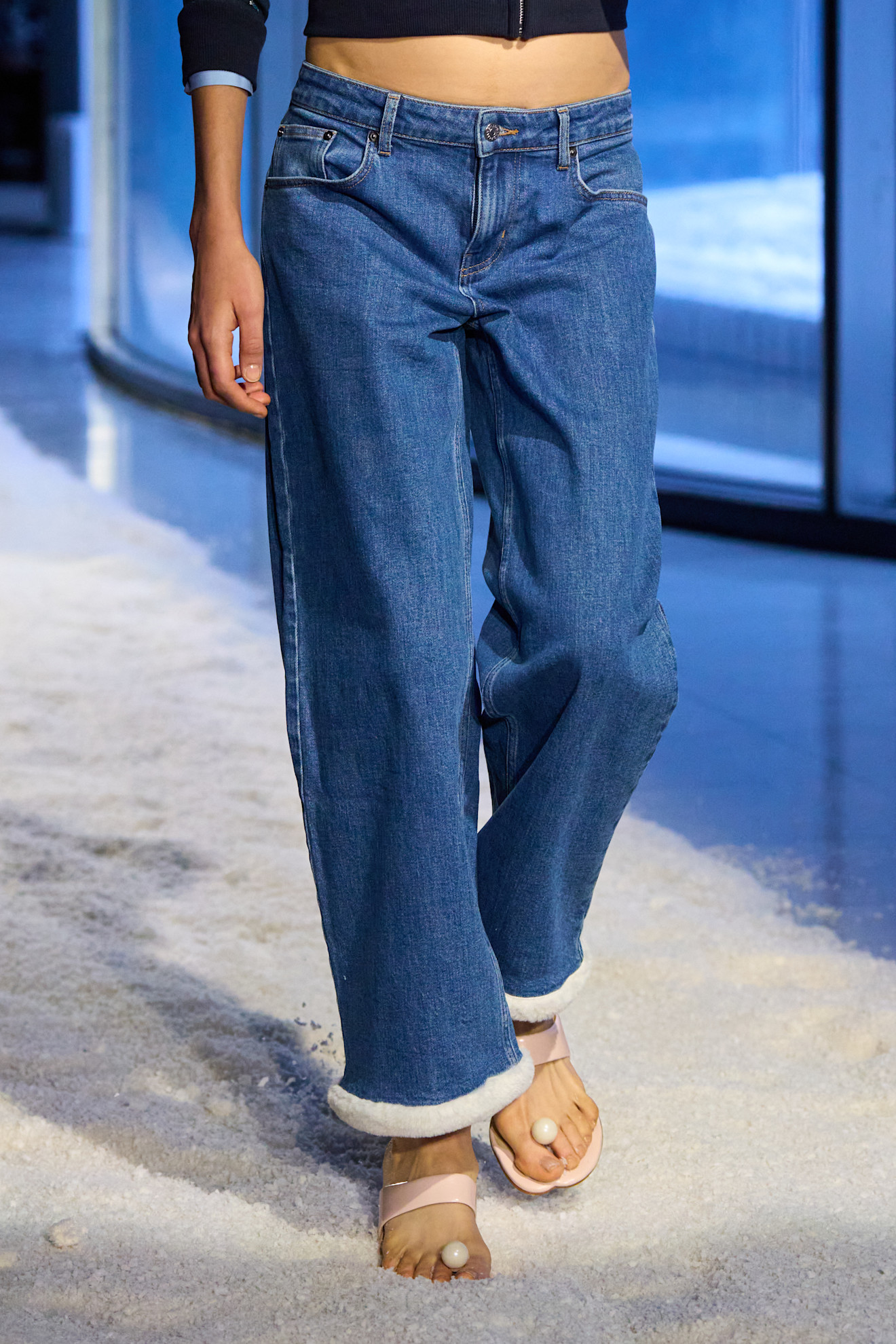 Sandy Liang model in low-rise jeans.