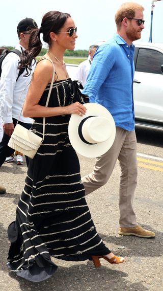 Meghan, Duchess of Sussex and Prince Harry, Duke of Sussex, walk during their visit to Cartagena