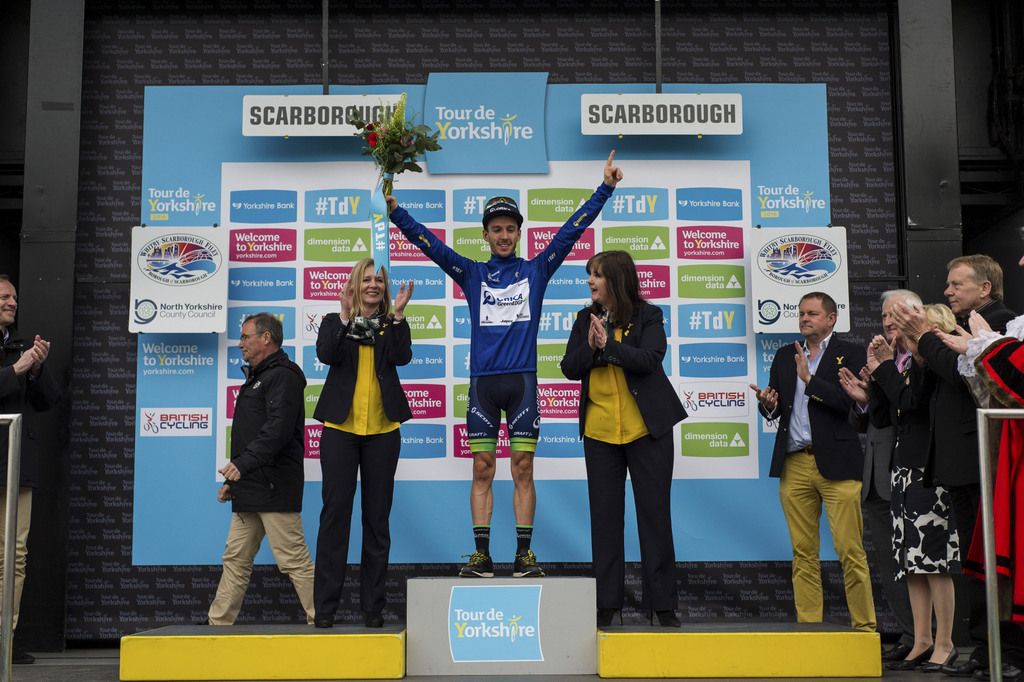 Adam Yates celebrates his jersey win
