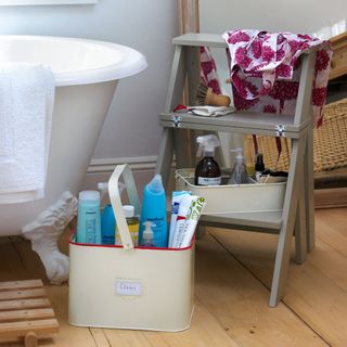 bathroom with bathtub wooden flooring and towel