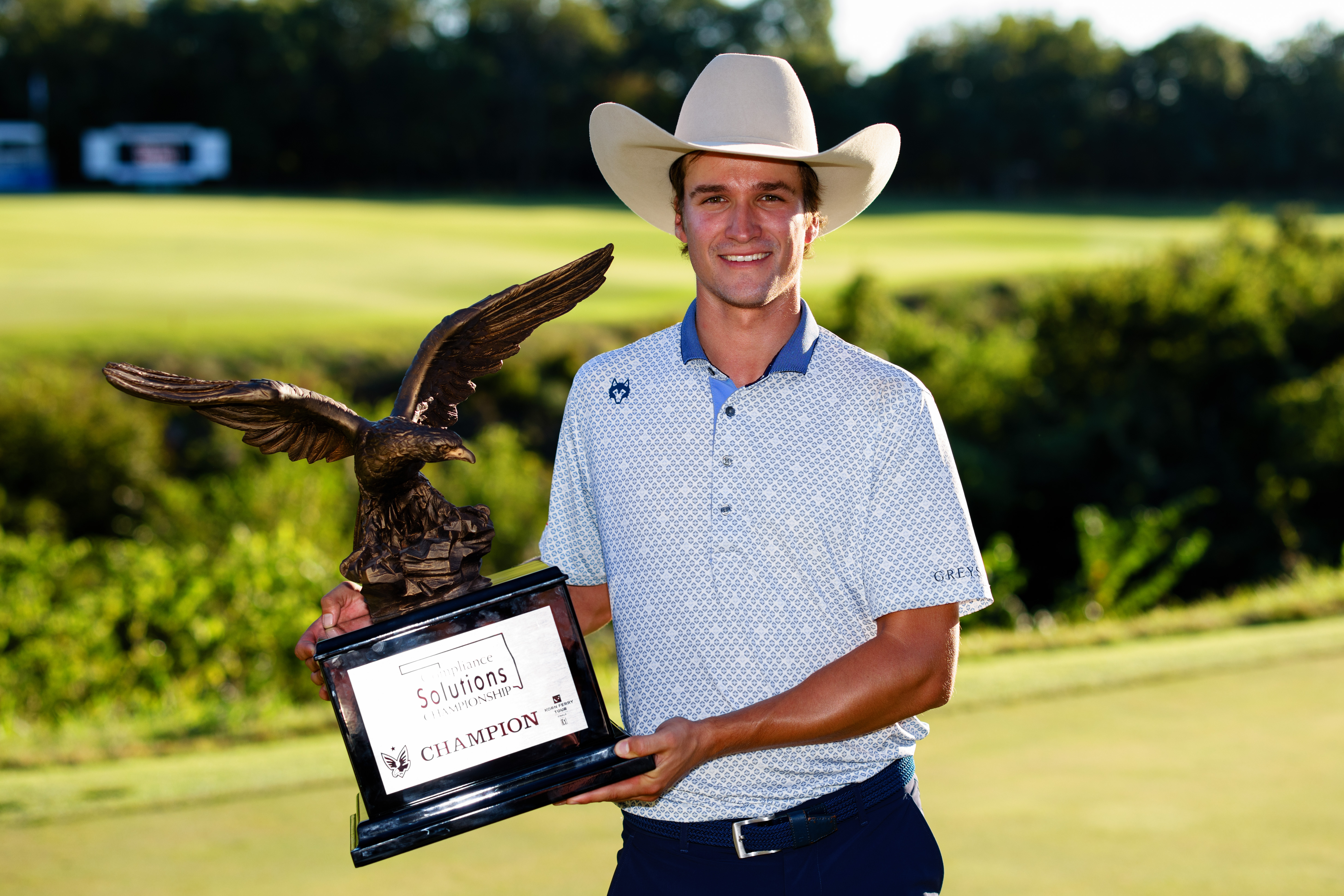 Adrien Dumont de Chassart holds a trophy