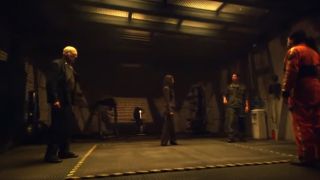 4 cast members of Battlestar Galactica facing each other.