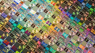 A top down view of a series of multi-coloured semiconductor wafers