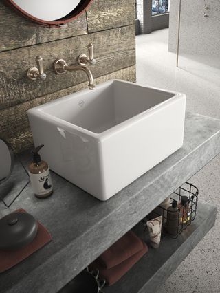 butler sink style basin on zinc countertop