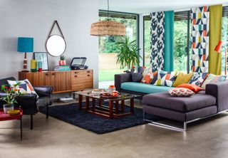 living room with combination of geometric and plain materials used as an example of how to mix pattern and prints in interiors by scion