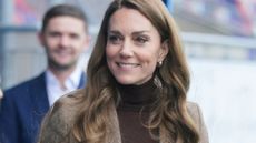 Catherine, Princess of Wales holds a rugby ball during a visit to Wakefield Trinity Rugby League club on January 27, 2026