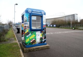 Empty programme stand outside the AMEX Stadium