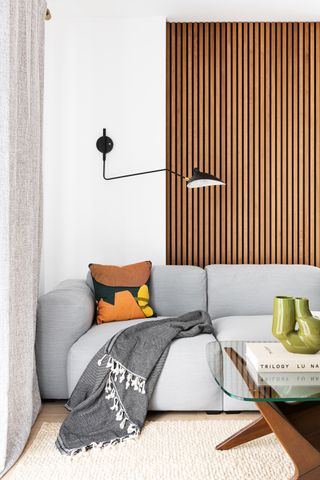 small living room lighting ideas black over reaching wall light by Interior Fox