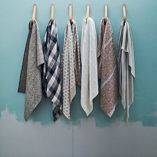 hanger with cloth on blue and grey wall