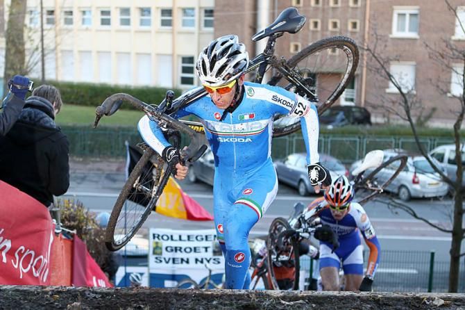 Italy's Enrico Franzoi runs the stairs at Roubaix