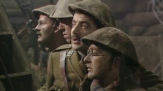 Rowan Atkinson and Tony Robinson stand in a trench awaiting orders in Blackadder Goes Forth's finale.