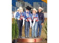 Bronze medal team Isobel Le Pla, Fiona Howard, Tabitha Sternberg Allen and Doug Allen (Chef d&rsquo;Equipe) on the podium