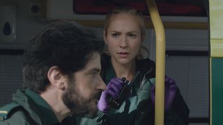 Shocked Ruby and regretful Lev talk in the back of an ambulance