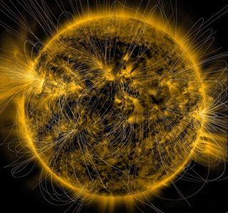 An illustration of solar magnetic field lines are overlaid on an image of the sun captured in March 2016 by the Solar Dynamics Observatory.