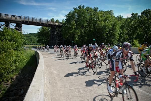 Riders pass by an old train trussle along the route.