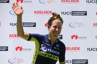 Amanda Spratt (Orica-Scott) waves from the podium